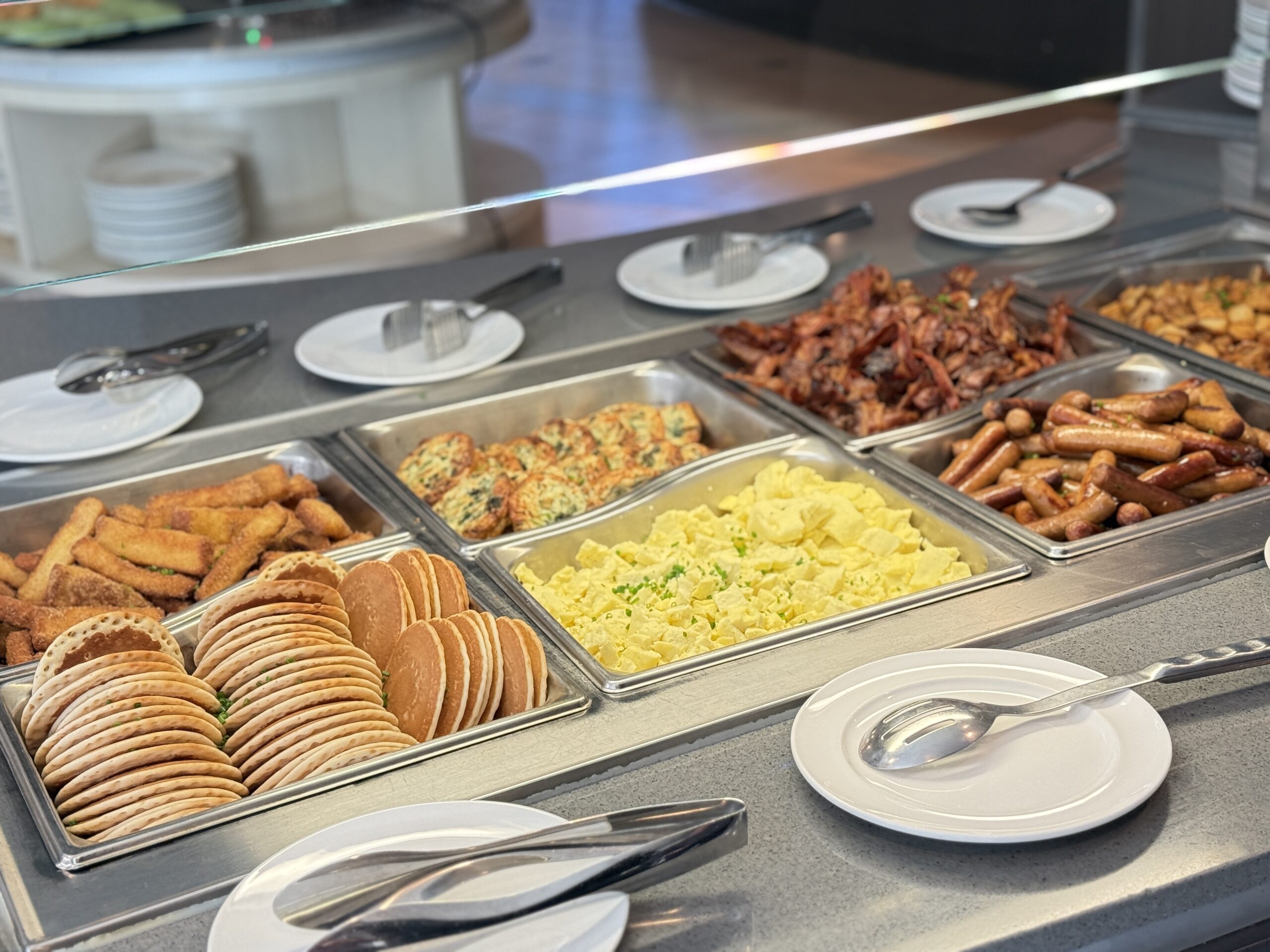 Breakfast buffet featuring pancakes eggs bacon and other brunch favourites